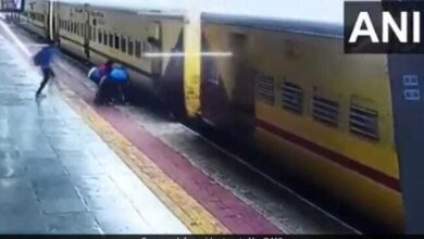 Woman trying to board a moving train slips, saved by passengers