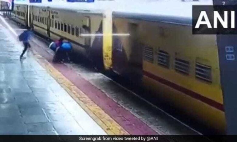 Woman trying to board a moving train slips, saved by passengers