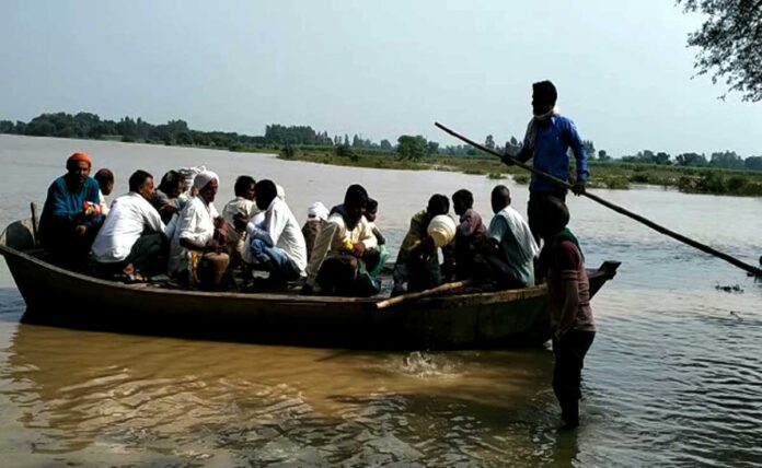 Villagers forced to sail on a broken boat in Hardoi district