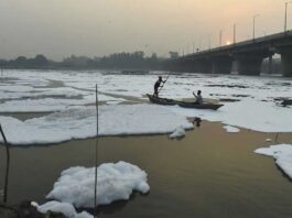 Barricades, boats, water sprinkling to keep away the toxic foam of Yamuna