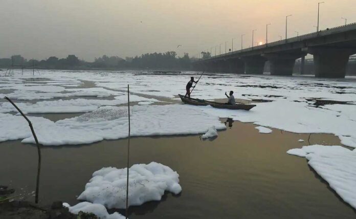 Barricades, boats, water sprinkling to keep away the toxic foam of Yamuna
