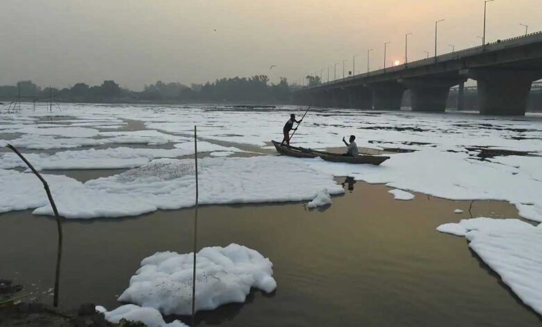 Barricades, boats, water sprinkling to keep away the toxic foam of Yamuna