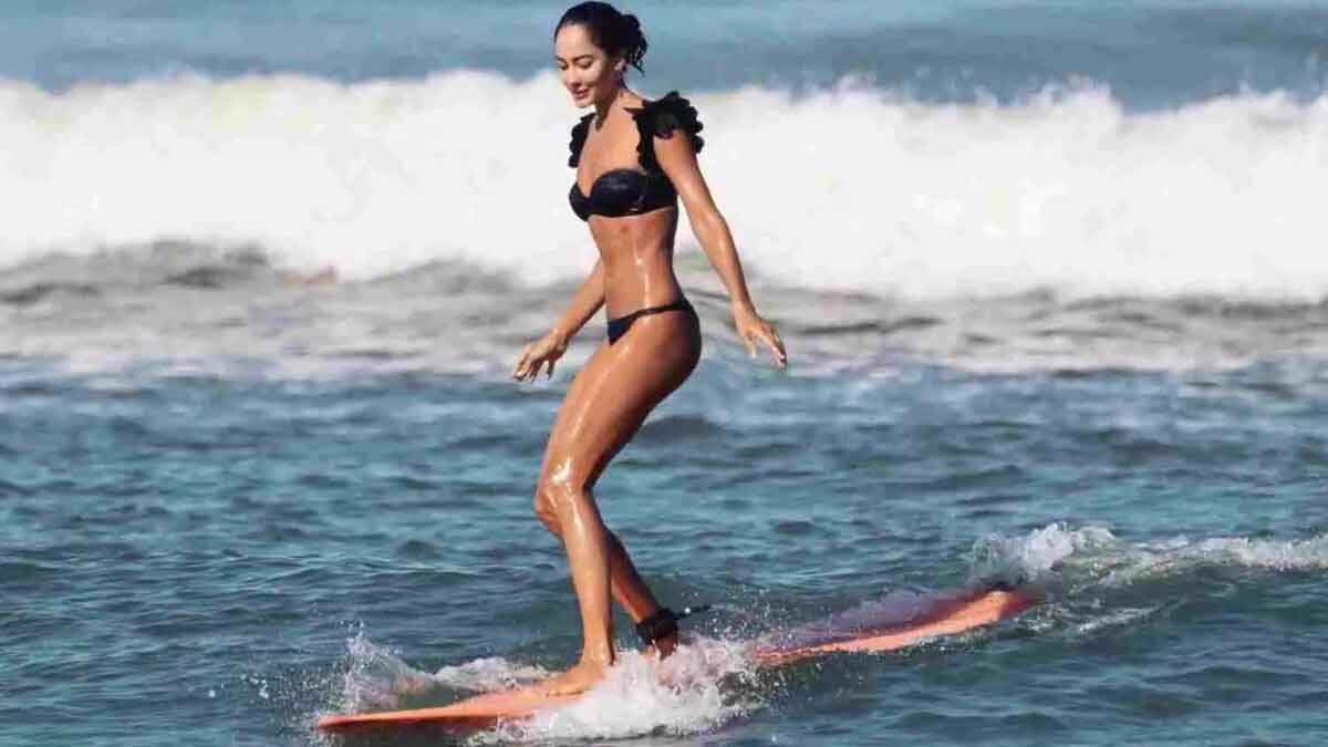 Lisa Haydon surf in Black Swimsuit