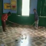 Broom being installed by children in Hardoi school