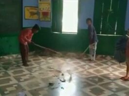 Broom being installed by children in Hardoi school