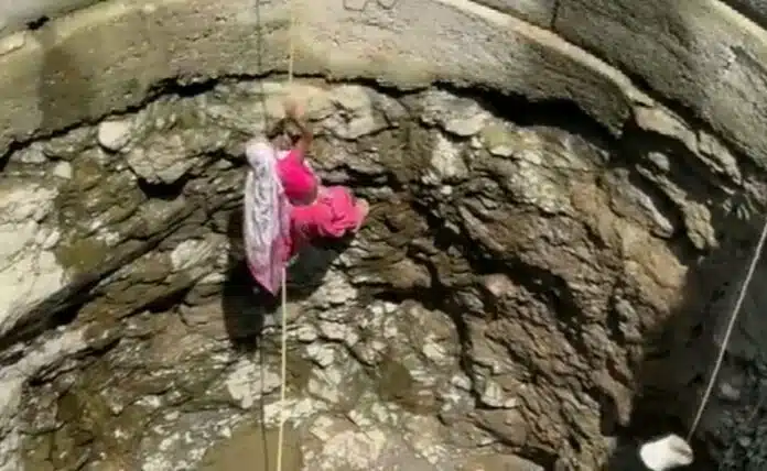Villagers suffering from water crisis forced to descend into wells
