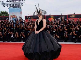 Lady Gaga in voluminous Dior gown and dramatic headpiece takes over the red carpet