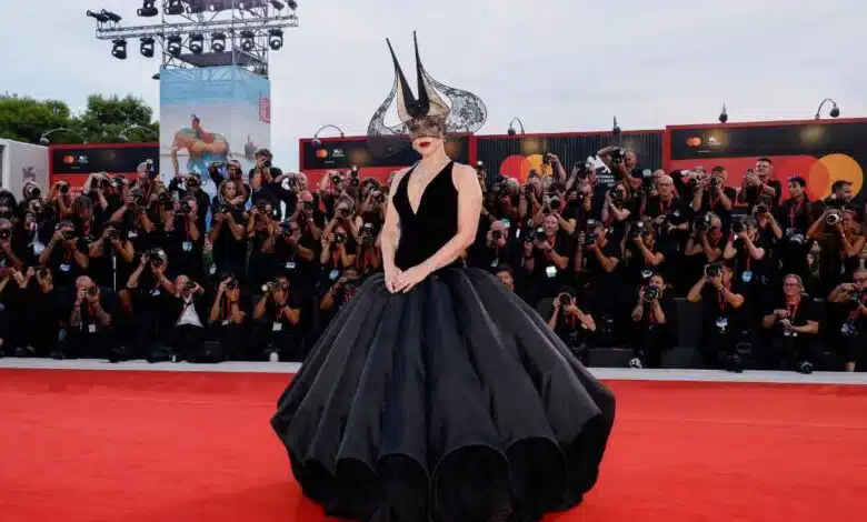 Lady Gaga in voluminous Dior gown and dramatic headpiece takes over the red carpet