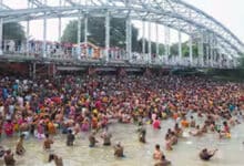 Devotees take a holy dip in the Ganga on Mahalaya Amavasya in Kolkata.