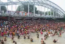 Devotees take a holy dip in the Ganga on Mahalaya Amavasya in Kolkata.