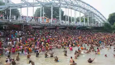 Devotees take a holy dip in the Ganga on Mahalaya Amavasya in Kolkata.