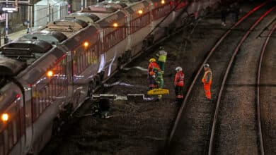 Several people were stabbed on a London-bound train in the UK; two suspects arrested.