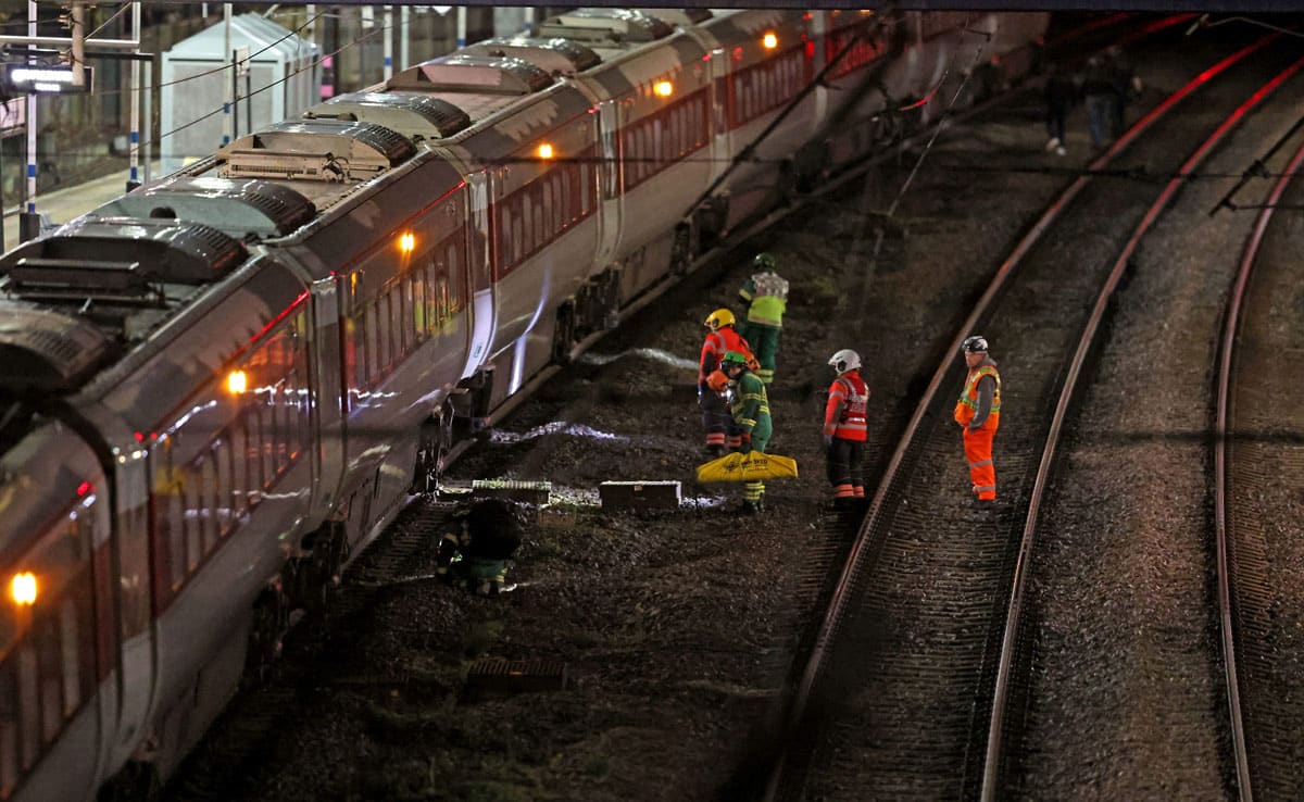 Several people were stabbed on a London-bound train in the UK; two suspects arrested.