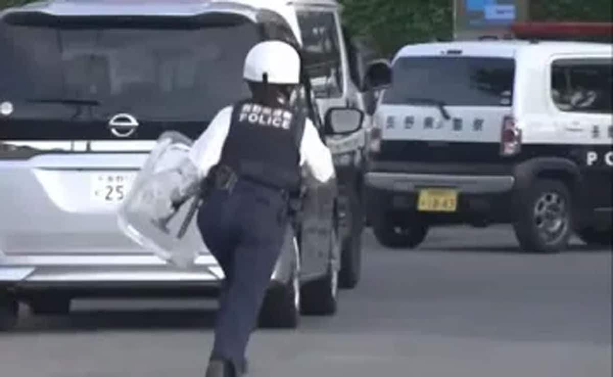 At least 14 people were injured in a stabbing and liquid spray attack at a factory in Japan; the suspect has been arrested.