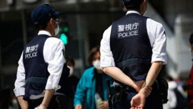 At least 14 people were injured in a stabbing and liquid spray attack at a factory in Japan; the suspect has been arrested.