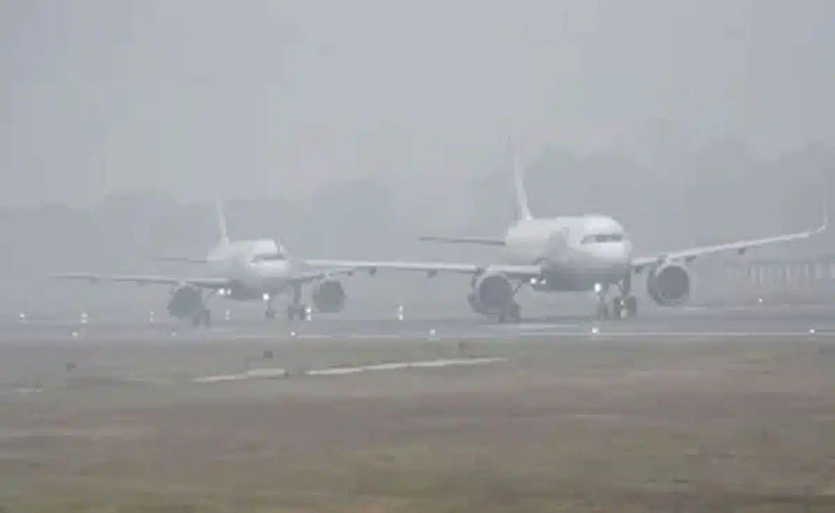 Dense fog blanketed parts of North India, affecting flight operations in Delhi-NCR; a red alert has been issued.