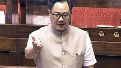 What message did Kiren Rijiju convey to the candidate regarding the exam bill